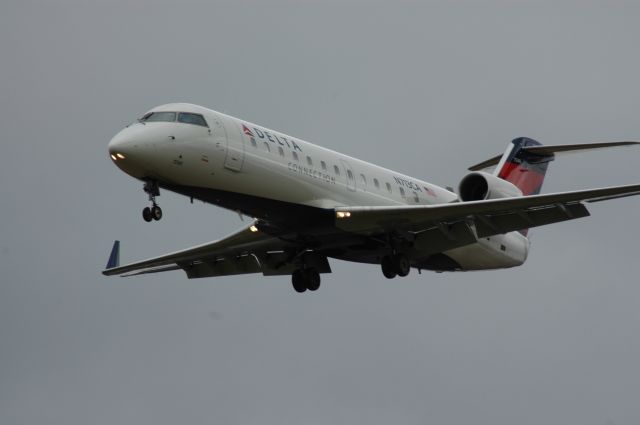 Canadair Regional Jet CRJ-200 (N713CA) - this is 1 of those very rare afternoons at KCVG, high winds out of 250 degrees force the airport to use Runway 27, the winds this day were 20 to 25 gusting to 41kts, sort final to 27    i can be reached for questions or comments at Truck10FMFD@aol.com