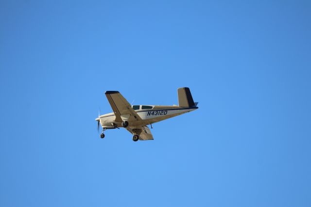 Beechcraft 35 Bonanza (N4312D) - Beechcraft Bonanza Butterfly  taken from Million Air
