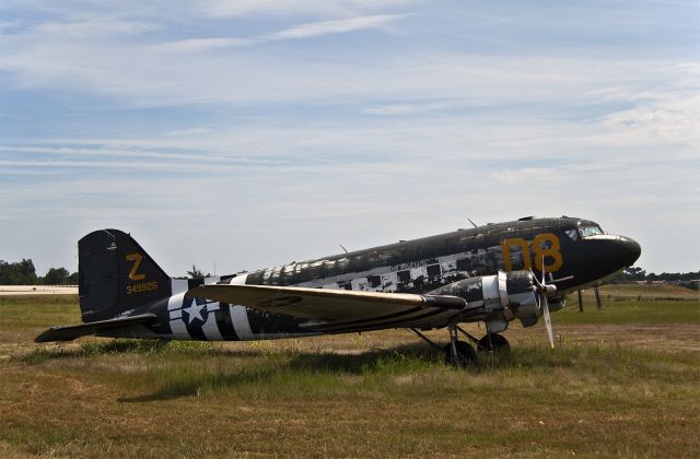 Douglas DC-3 (N12907) - Aviation Archaeology-This old derelict still sits in the thinning grass towards the end of 18L in Charlotte, NC USA. 9 Sept 10