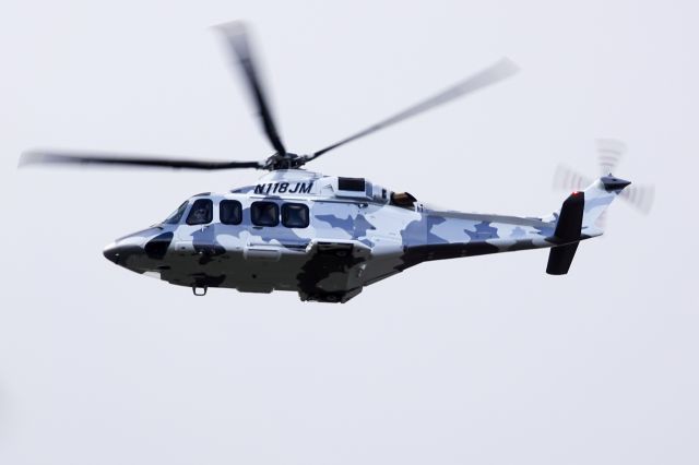 N118JM — - N118JM sporting a camo livery enroute over NJ on an overcast afternoon.