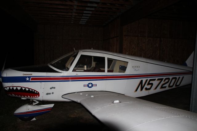 Piper Cherokee (N5720U) - Piper Cherokee with a neat "shark-nose" design, abandoned at the defunct De Vere Airfield.