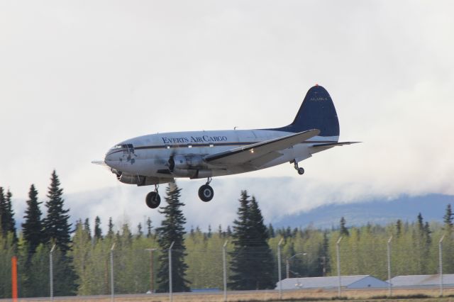 CURTISS Commando — - C-46 coming in. Nose art Dumbo.