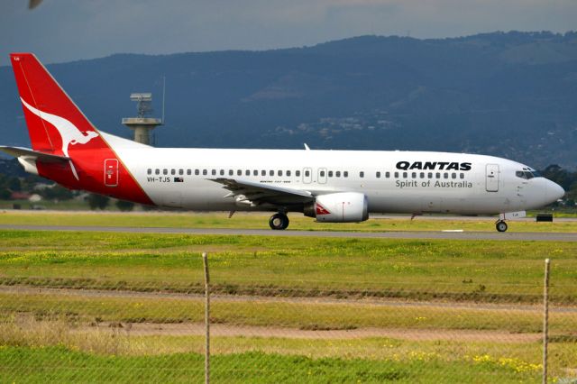 BOEING 737-400 (VH-TJS) - On taxi-way heading for take off on runway 05. Thursday 12th July 2012.