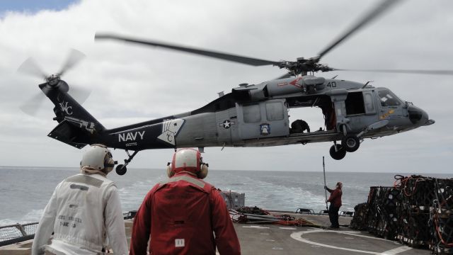 Sikorsky S-70 (16-5776) - USN Sikorsky MH-60S "Sea Hawk," assigned to Helicopter Sea Combat Squadron 23, conducting vertical replenishment operations between the USNS SHASTA (T-AE 33) and USS CARL VINSON (CVN 70).