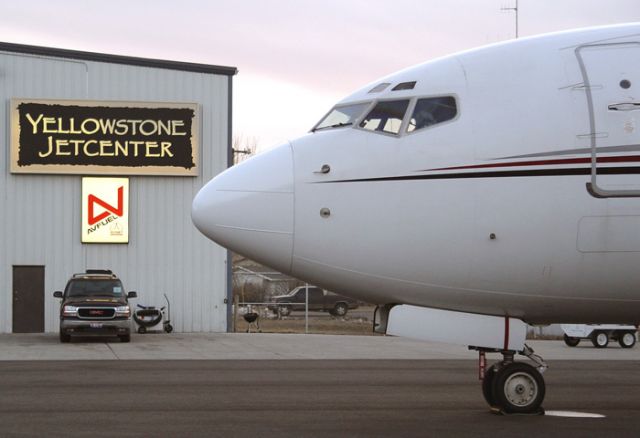 Boeing 737-700 (N129QS) - NetJets BBJ on the Yellowstone Jetcenter ramp.