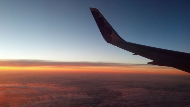 N581HA — - Sunset over the Pacific Ocean enroute to KPHX from PHNL