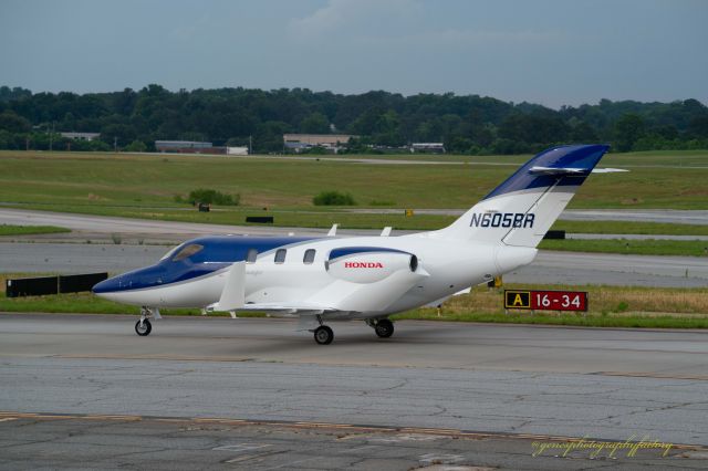 Honda HondaJet (N605BR) - Blue and white Honda jet, just landed at PDK. 