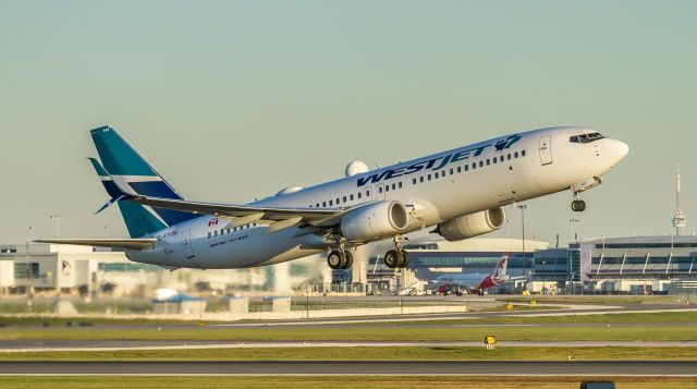 Boeing 737-800 (C-FYBK) - WJA665 climbs off runway 23 and heads to Calgary near sunset at YYZ