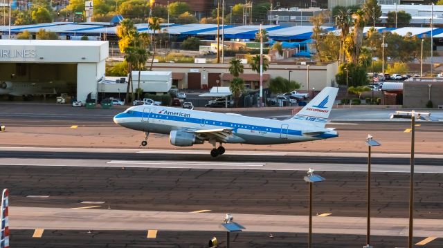 Airbus A319 (N744P) - American Airlines A319 in Piedmont Airlines retro livery landing at PHX on 7/7/22. Taken with a Canon 850D and Rokinon 135mm f/2 lens.