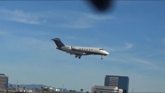 Canadair Challenger 350 (N571FX) - Just over the threshold from a unknown airport.