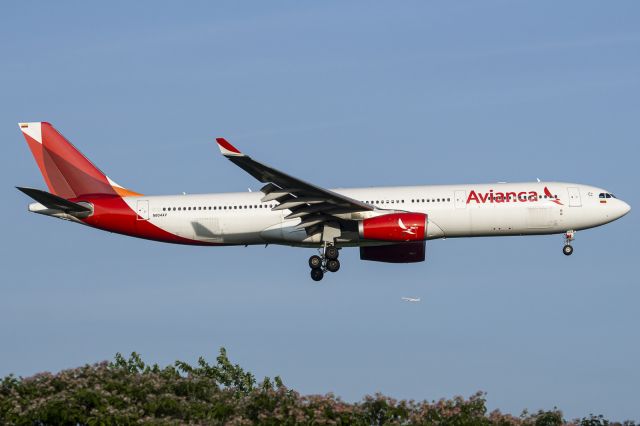 Airbus A330-300 (N804AV) - Avianca A330-300 on short final for 22R @ JFK, while in the distance, another A330-300, for Finnair, is in the climb out of JFK.