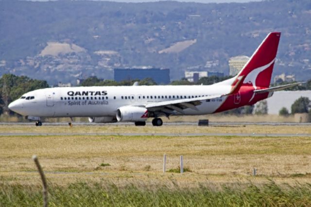 Boeing 737-800 (VH-VXN) - On taxi-way heading to Terminal 1 after landing on runway 23, on the last day of the Australian summer. Thursday 28th February 2013.