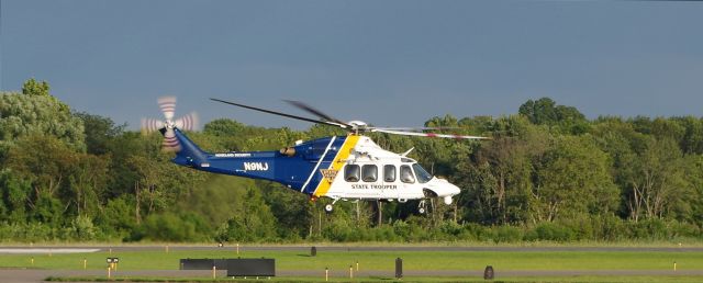 BELL-AGUSTA AB-139 (N9NJ) - MORRISTOWN, NEW JERSEY, USA-AUGUST 09, 2019: A New Jersey State Police Helicopter, registration number N9NJ, is seen taking off from Morristown Municipal Airport shortly after the arrival of President Donald Trump on board Air Force One. The NJSP helped provide security for the President and Air Force One.