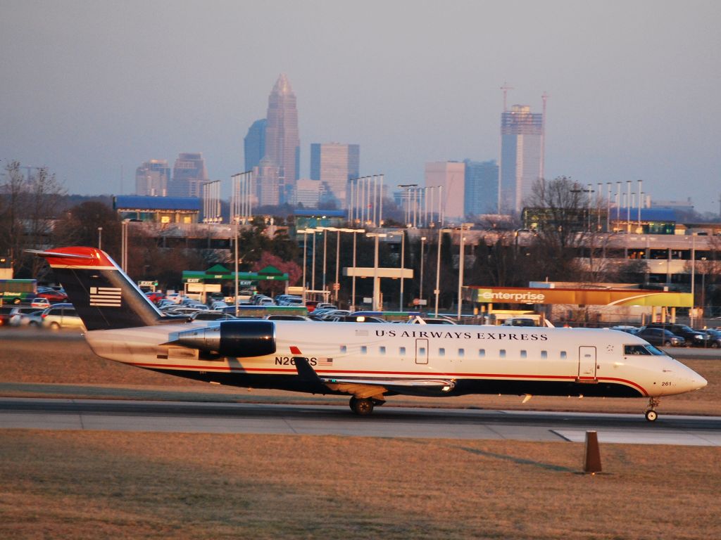 Canadair Regional Jet CRJ-200 (N261PS) - Taking off on runway 18C at Charlotte Douglas International Airport - 2/14/09