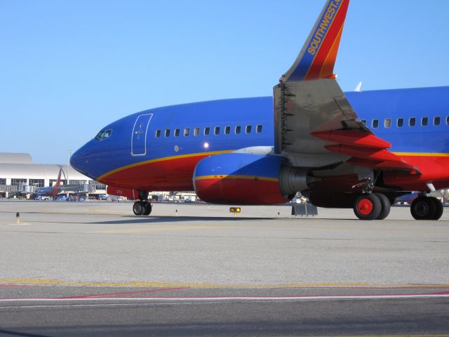 Boeing 737-700 (N272WN) - Holding short of RWY 19R