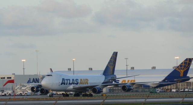 Boeing 747-400 (N497MC) - Being flanked by a fellow B747-400F Reg#N475MC.In the cargo bay