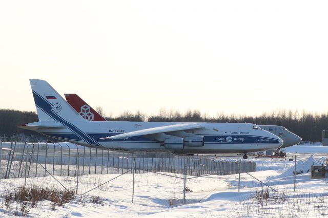 Antonov An-124 Ruslan (RA-82043) - Cargo tie down lot near Fed Ex terminal, fresh snow on wings, Cargolux 747 in background