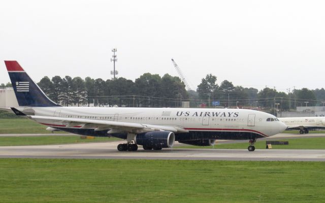 Airbus A330-300 (N279AY) - TAKEN JUNE 27, 2013br /TAKEN JUNE 27, 2013  NOTE: IT WAS RAINING...THE WATER VAPOR BEING SUCKED INTO ENGINES