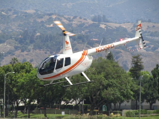 Robinson R-44 (N335PD) - Lifting off from RWY 26L