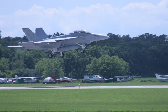— — - Arrival Traffic a Super F-18 Hornet Lands Runway 36 Oshkosh EAA 2010