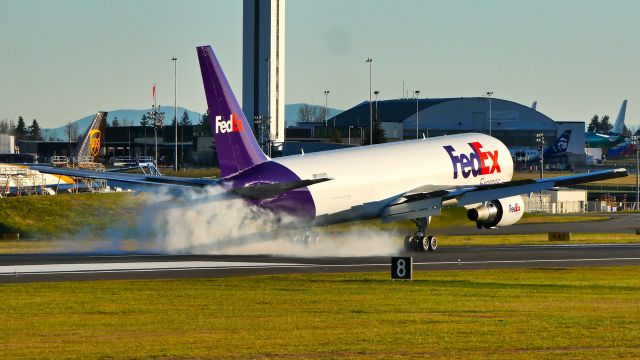 BOEING 767-300 (N189FE) - BOE648 makes tire smoke on landing on Rwy 16R to complete a flight test on 12.2.20. (B767-300(ER) / ln 1225 / cn 63120).