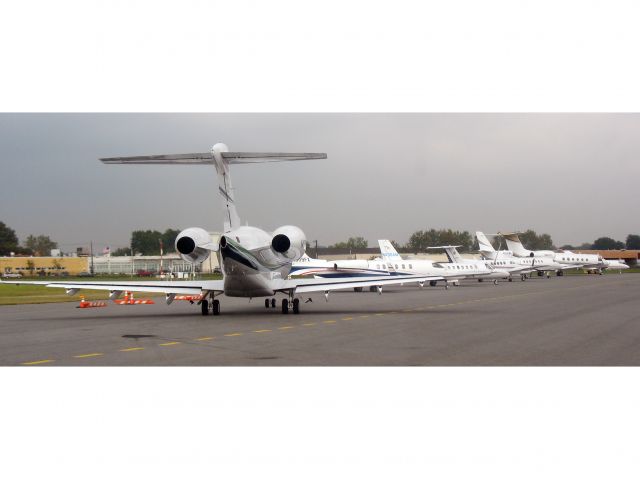 Bombardier Challenger 300 (KTEB) - In line for departure runway 24 at KTEB. ATC does a very good job, but in this case, storms on the departure fixes caused a delay.