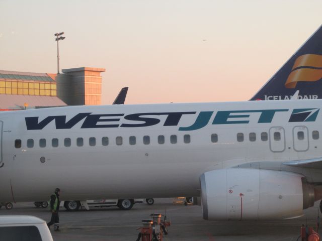 Boeing 737-800 — - Waiting to pushback, another WestJet beauty sitting at the gate next to us !