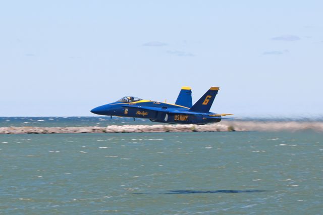 McDonnell Douglas FA-18 Hornet (16-3741) - Cmdr. Frank Weisser, Opposing Solo pilot, skimming over Lake Erie on takeoff in Blue Angel #6, 163741, cn 812/C100, during a Cleveland National Air Show Friday afternoon practice on 2 Sept 2016. Photo taken from North Coast Harbor, E. 9th Street Pier/Voinovich Park.