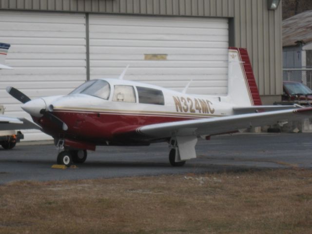 Mooney M-20 (N324MC) - A nice Mooney parked in front of Twin City Airmotive.