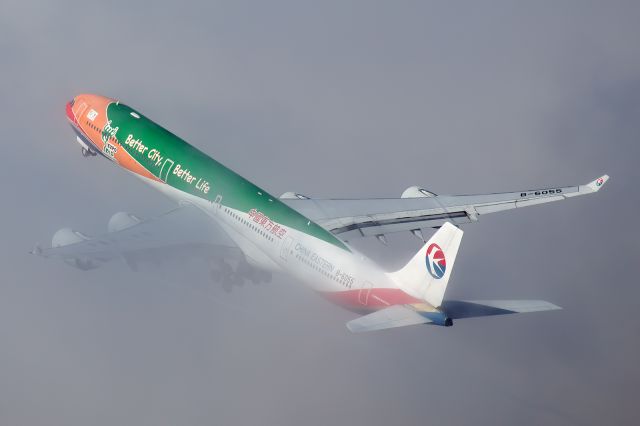 B-6055 — - Lifting through the fog at LAX. 