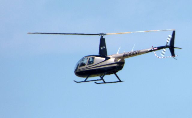 Robinson R-44 (N666NY) - Shown here in the Summer of 2018 is a Robinson R44 Helo just after departure. 