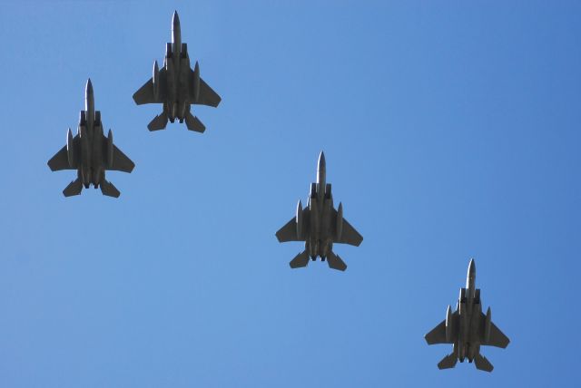 — — - A flight of four F-15s from the Oregon ANG flying over the USAFA for family weekend 2009.