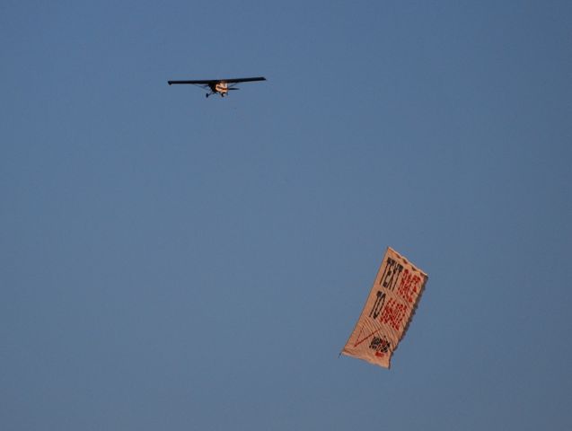 — — - VAN WAGNER AERIAL MEDIA LLC / On approach to 02 to drop-off the banner before landing. - 10/16/10