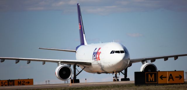 Airbus A300F4-600 (N669FE) - Turning from taxiway Mike to Sierra Charlie.