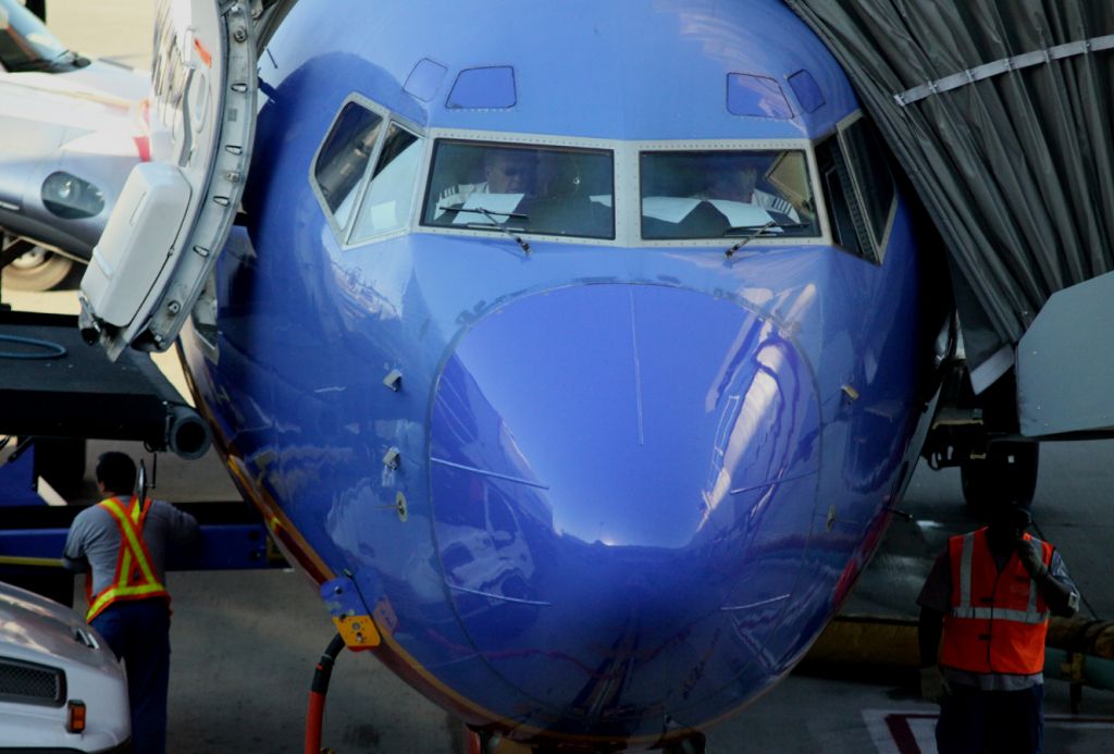 Boeing 737-700 (N470WN) - Parked at Gate # 22, Aircraft is being serviced while the Captain and Co-Pilot prep for departure