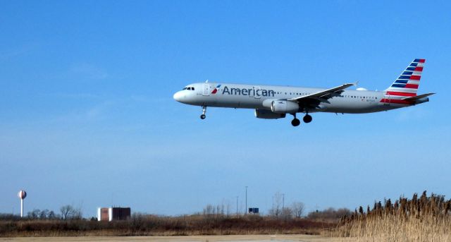 Airbus A321 (N975UY) - On short final is this 2011 American Airlines Airbus 321-231 in the Winter of 2022.
