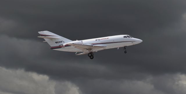 Dassault Falcon 20 (N531FL) - Storm clouds rolling in from Lake Erie west of IAG make N531FL stand out quite nicely.