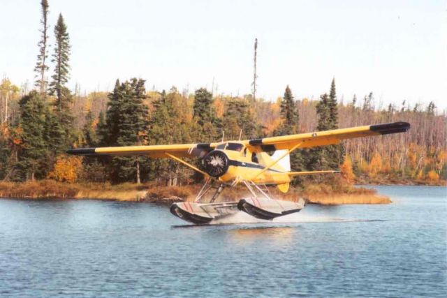 — — - Touching down. Arnston Lake, northern Ontario.