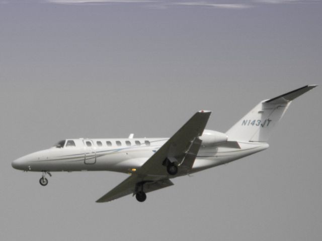 Cessna Citation CJ3 (N143JT) - This 2007 Cessna Citation is one of many of line of small Cessna business Jets. This work horse is shown here on final in the Spring of 2014.