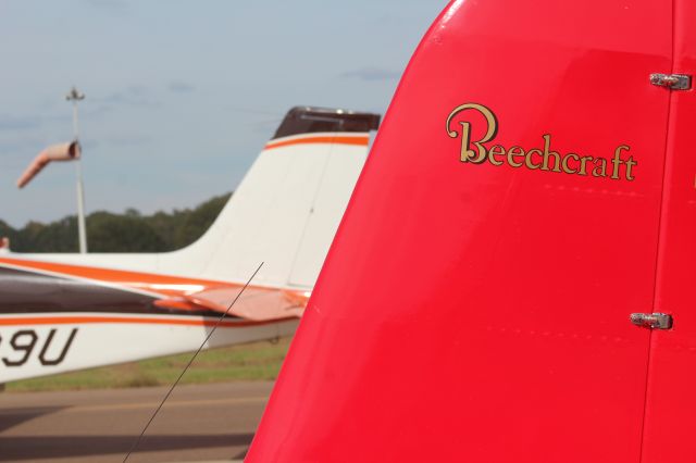 Beechcraft Staggerwing (N9470H) - With the passing tail of 1965 Beech 35-C33 Debonair N8909U