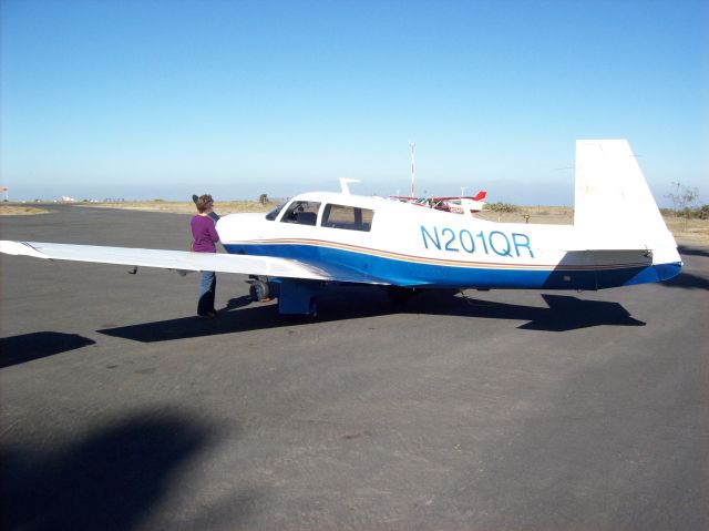 Mooney M-20 (N201QR) - 1977 Mooney M20J. Photo of Owner/Pilot conducting preflight, taken December 2008 at Catalina Airport In The Sky.