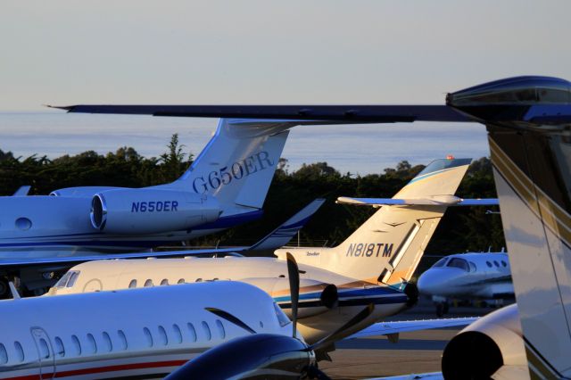 Hawker 800 (N818TM) - KMRY - 8TM squeezing past the earlier arrivals and headed to the Monterey Jet center FBO tarmac.