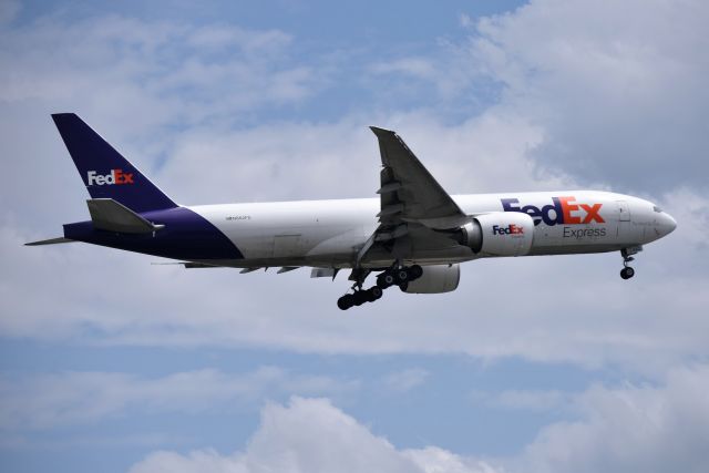 BOEING 777-200LR (N862FD) - On final for 23-L on Tuesday afternoon, 05-15-18