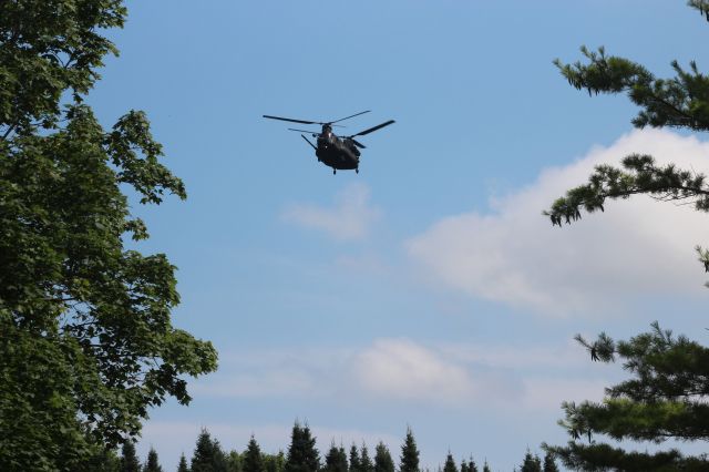 — — - Hovering for 20 minutes above an Oshkosh field before cleared to land at Wittman Field 