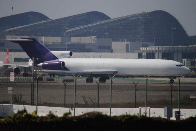 Boeing 727-100 (N217FE) - Departing LAX 24L for desert storage/retirement. Photo taken about a decade ago.