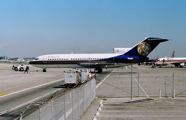 Boeing 727-100 (N504MG) - KLAX - MGM GrandAir being backed into the Imperial Terminal as this was a very tight ramp and several aircraft using the tarmac daily.