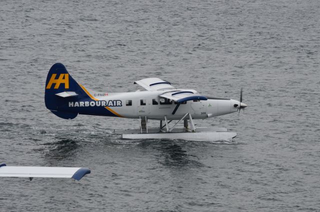 De Havilland Canada DHC-3 Otter (C-FIUZ) - Harbour Air DHC-3 Turbine Single Otter seaplane taxiing at Vancouver Harbour.