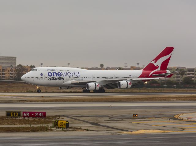 Boeing 747-200 (VH-OEF) - Morning Kangaroo  This 747 has just landed in Los Angeles, California USA about 6:30 am. Wing spoilers are up and engine thrust reversers are activated on its big GE engines.