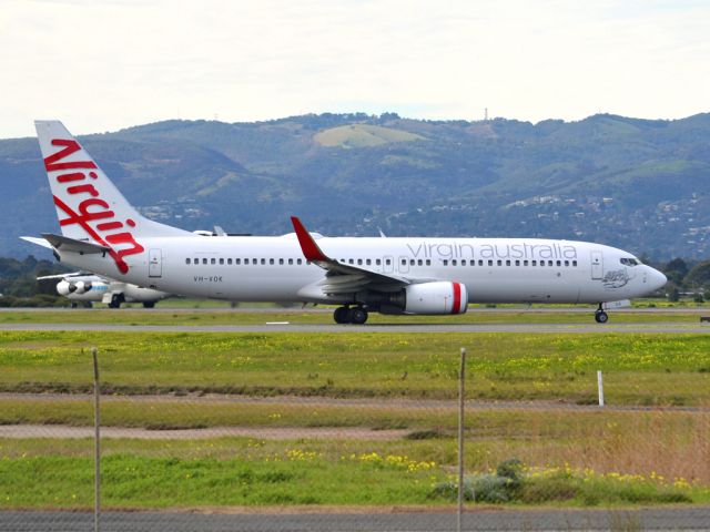 Boeing 737-700 (VH-VOK) - On taxi-way heading for take off on runway 05. Thursday 12th July 2012.