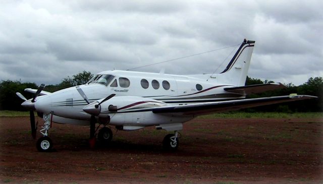 Beechcraft King Air 90 (ZS-OAE) - At a mine strip in South Africa.